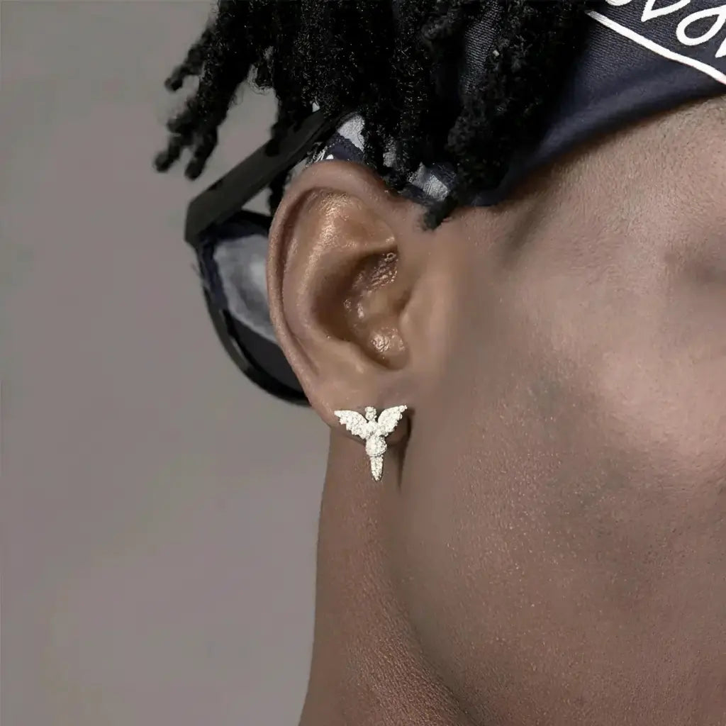 Gold angel wing stud earring with intricate details and a shiny finish