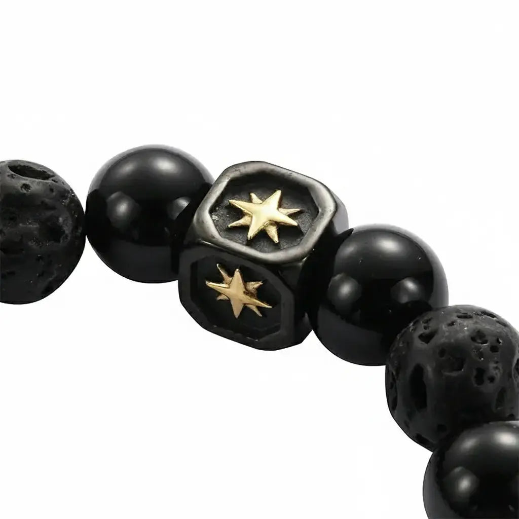 Black beaded bracelet with gold star accents and hexagonal centerpiece